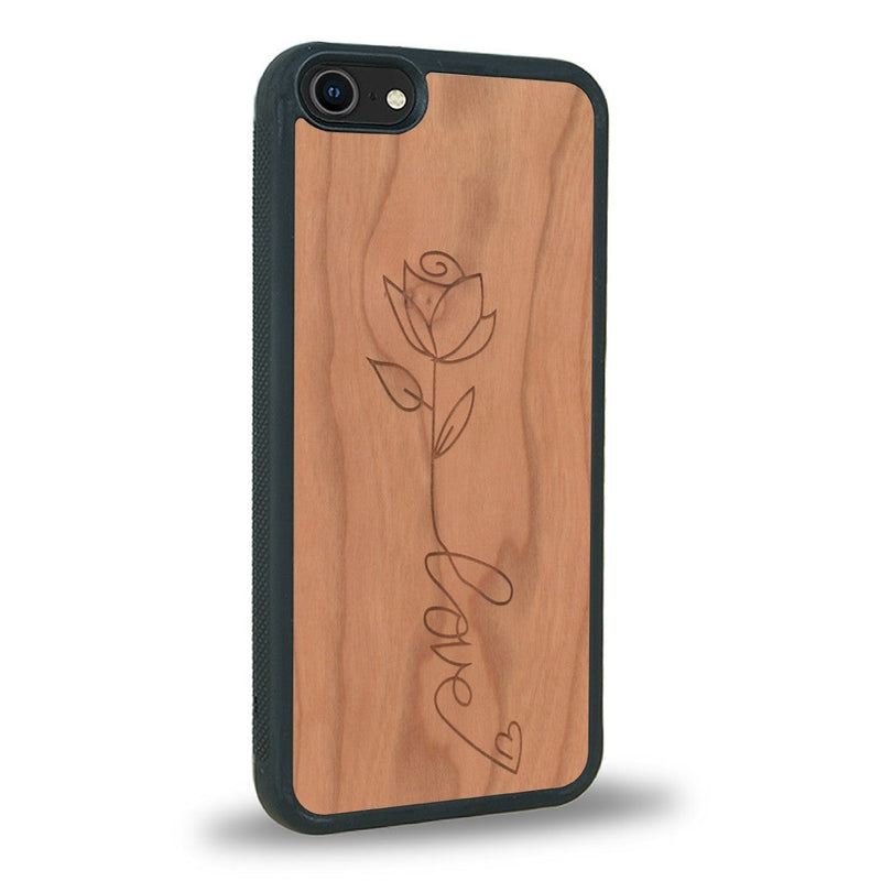 Coque de protection en bois véritable fabriquée en France pour iPhone 5 / 5s sur le thème de la fête des mères avec un motif représentant une fleur dont la tige forme le mot "love"