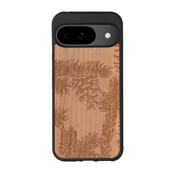 Coque de protection en bois véritable fabriquée en France pour Google Pixel 9 sur le thème de la nature des arbres avec un motif de gravure représentant des épines de sapin et des pommes de pin