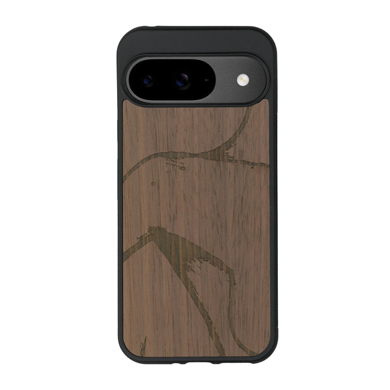 Coque de protection en bois véritable fabriquée en France pour Google Pixel 9 représentant une silhouette féminine dessinée à la main par l'artiste Maud Dabs