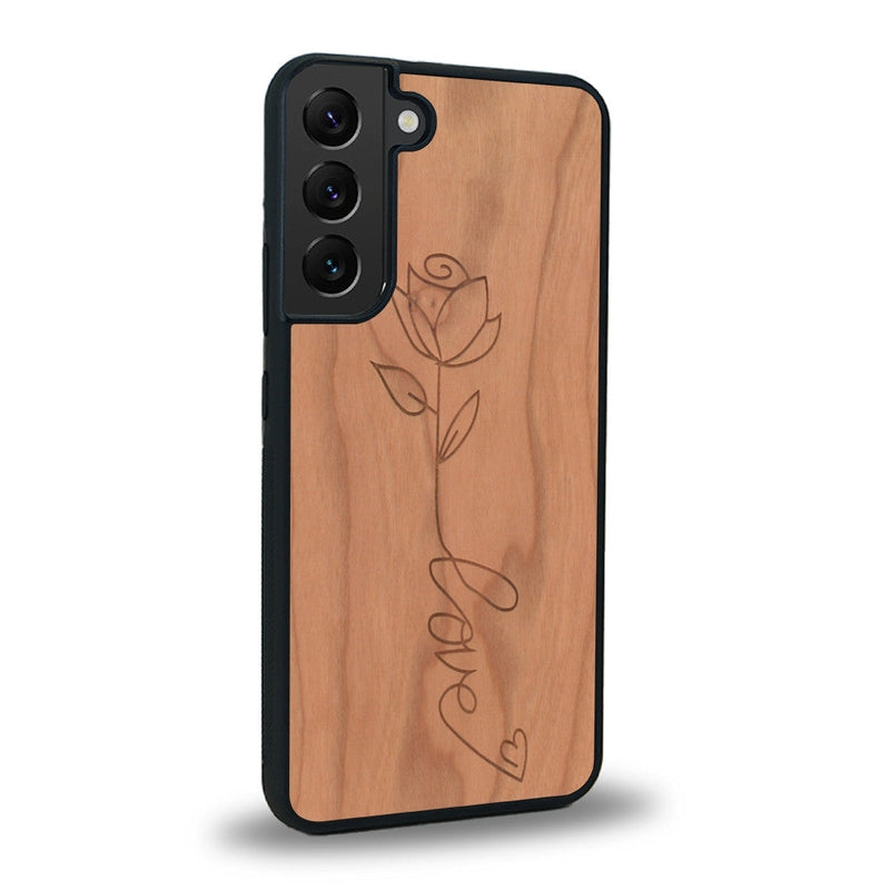 Coque de protection en bois véritable fabriquée en France pour Samsung S21 sur le thème de la fête des mères avec un motif représentant une fleur dont la tige forme le mot "love"