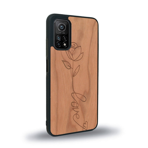 Coque de protection en bois véritable fabriquée en France pour Xiaomi Mi 10 Lite sur le thème de la fête des mères avec un motif représentant une fleur dont la tige forme le mot "love"