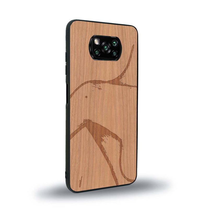 Coque de protection en bois véritable fabriquée en France pour Xiaomi Poco X3 Nfc représentant une silhouette féminine dessinée à la main par l'artiste Maud Dabs