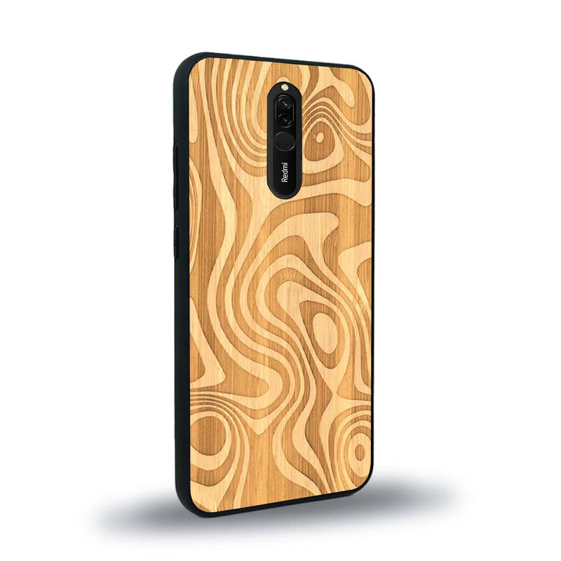 Coque de protection en bois véritable fabriquée en France pour Xiaomi Redmi 8 avec un motif abstrait représentant les mouvements de l'eau